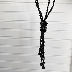 2 strands of black crystal beads. Worn as lariat or wrap necklace.